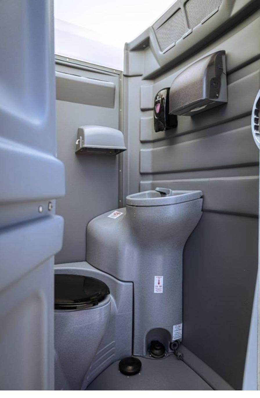 Interior view of a spacious ADA accessible portable restroom