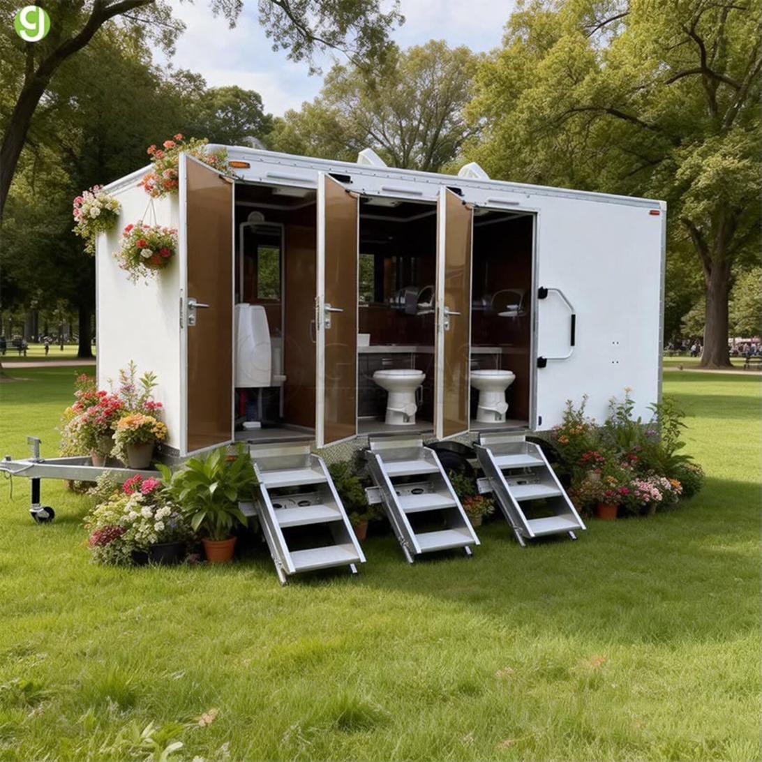Luxury restroom trailer decorated with string lights for an event